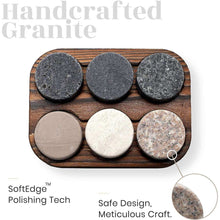 Handcrafted granite whiskey stones on a wooden tray, perfect for chilling drinks without dilution.