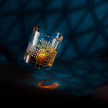 Elegant whiskey glass featuring rich bourbon; perfect for barware and gifting.