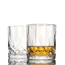 Elegant whiskey glasses set, one filled with golden whiskey, perfect for chilling rocks and cocktail enjoyment.