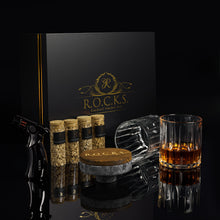 The Cocktail Smoker Kit includes a smoker, whiskey glass, wood chips, and elegant packaging for smoky cocktails.