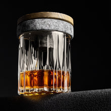 The Cocktail Smoker Kit showcasing whiskey in an elegant glass with natural granite top.