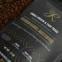 Bourbon Barrel Aged Coffee bag featuring Colombian Fair Trade coffee with tasting notes of chocolate and hazelnut.