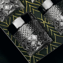 Elegant set of Admiral whiskey glasses set against a stylish geometric background, perfect for cocktails and spirits.