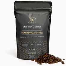 12 oz bag of Bourbon Barrel Aged Coffee, featuring Colombian Fair Trade beans, roasted medium-dark for a rich flavor.