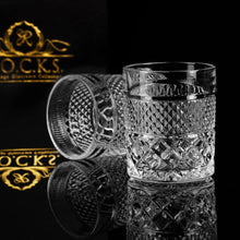 Crystal whiskey glasses from the Privilege Collection on a reflective surface, perfect for cocktails and whiskey tasting.