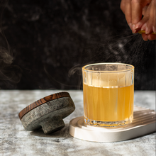 The Cocktail Smoker Kit with whiskey smoking set enhancing a crafted cocktail on a stylish surface.