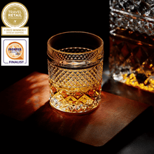 Stylish crystal whiskey glass filled with amber whiskey, showcasing premium barware for whiskey lovers.