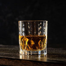 Elegant Monarch Eco Crystal whiskey glass showcasing rich amber whiskey, ideal for sipping and swirling during tastings.