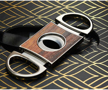 Elegant cigar cutter featuring wooden design and stainless steel accents, perfect accessory for cigar aficionados.