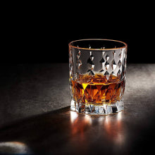Crystal whiskey glass featuring rich amber drink, perfect for barware, cocktail gifts, and special occasions.