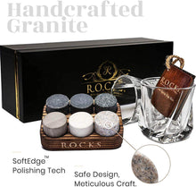 Handcrafted granite whiskey chilling stones in a gift set with a bourbon glass, perfect for whiskey lovers.