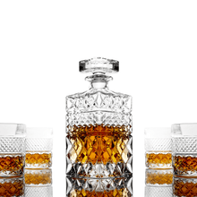 Elegant whiskey decanter gift set with crystal glasses, perfect for bourbon or scotch lovers.