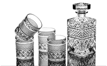 Elegant whiskey decanter set with four crystal glasses, perfect for barware and entertaining.